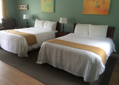hotel room with two queen beds